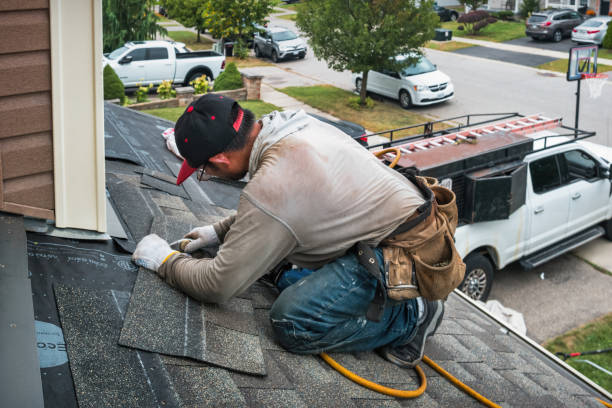 Professional Roofing technician working in Mansfield, MA